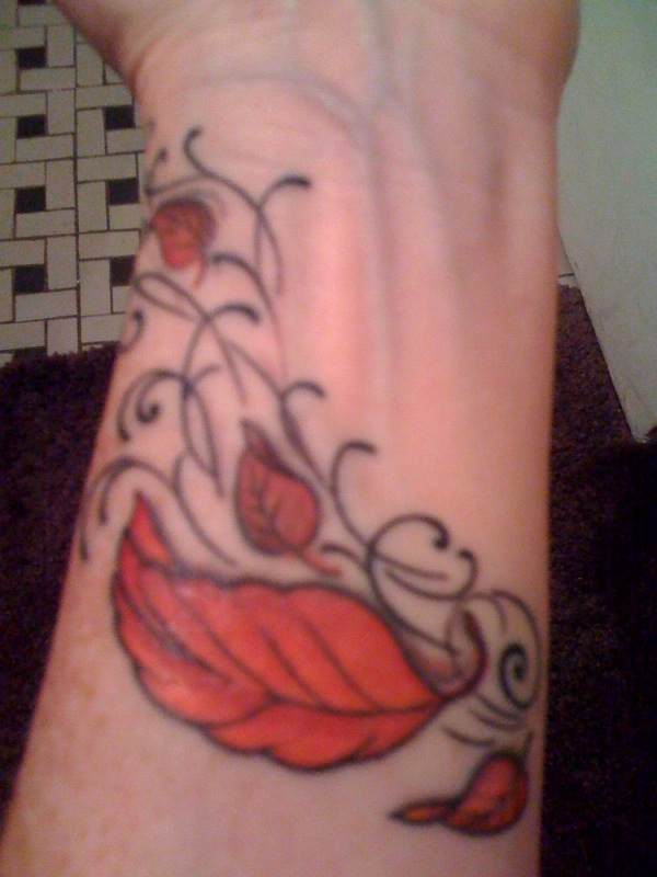 I love my new tattoo Oh and the new little red leaf on the bottom right is 